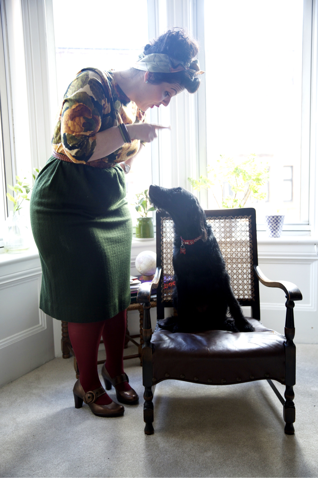 Hayley Angell founder of Love is in the Detail models outfit from Vintage Style Challenge posing with Labradoodle puppy Hettie.